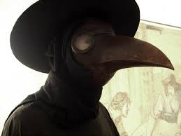 Nostradamus' Hallowween costume, the leather bird mask, hat and cape of a plague doctor of his day.