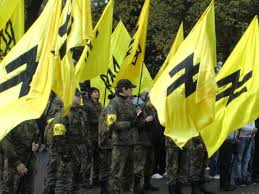 Left: Ukrainian Neo-Nazi Svoboda militia, formerly known as the Ukrainian Socialist Nationalist Party. 