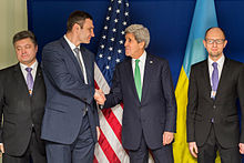 Odd man out in front in the polls, Poroshenko (left) with Klychko, Kerry and Yastenyuk, (far right, in more ways than his position on this picture.