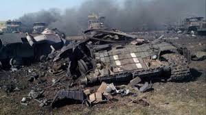 The anti-Kiev forces document their successes, such as this Ukrainian armored column destroyed by their Grad missile launching artillery in July 2014.