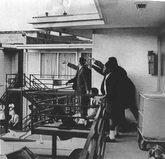 Moments after the sniper killed Martin Luther King Jr., His aides are pointing to in the direction of the rifle shot.