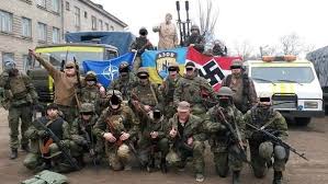 Here is the Azov Battalion taking a break from fighting the Ukrainian Civil War to show their blue and yellow Ukrainian banner with the reversed SS Nazi symbol (center) and a Swastika. To them, Bandera is the "George Washington" of Ukraine.