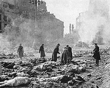 The aftermath of the Dresden allied fire bombing. Bodies are being laid out in preparation for being put on large funeral pyres made of railroad ties.