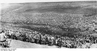 Tens of thousands of Soviet soldiers captured from the Kiev pocket are gathered in a shallow valley, most likely where they would stay, surrounded later by barbwired fences. Most dying of starvation and neglect.