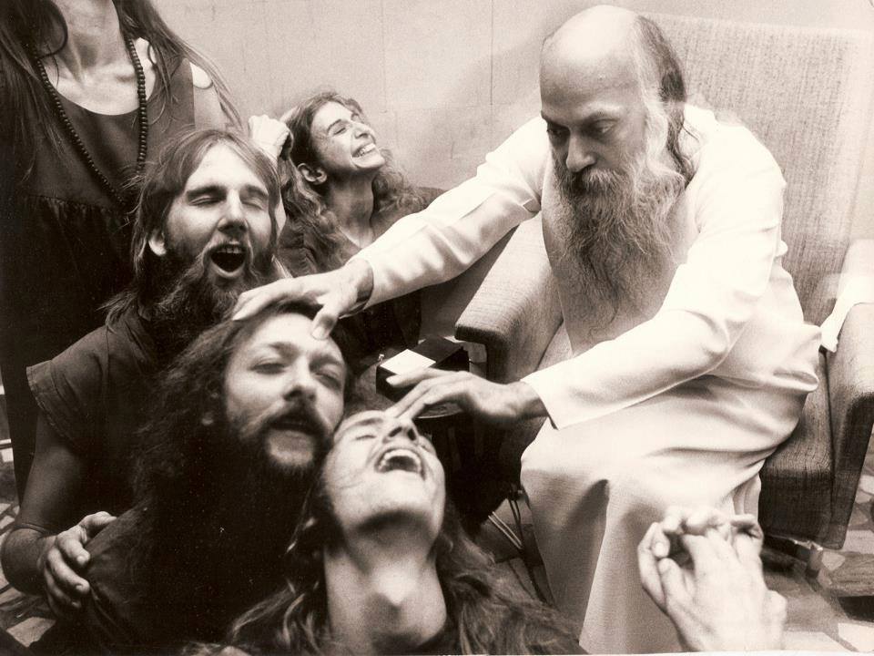 Osho giving energy darshan in Pune, India in the 1970s.