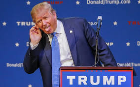 TrumpHoldingEarTongueOut