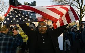 BlackProtesterUpsideDownFlag