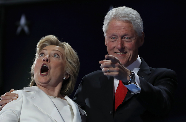 Democratic presidential nominee Hillary Clinton and Former President Bill Clinton react as balloons fall during the final day of the Democratic National Convention in Philadelphia, Thursday, July 28, 2016. (AP Photo/Carolyn Kaster)