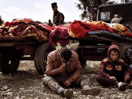 Mosul-CartsWDeadCryingManStunnedChild