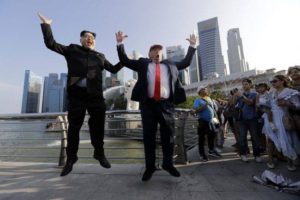 Kim and Trump doubles jump for joy in Singapore. AP Poto: Wong Maye-E.