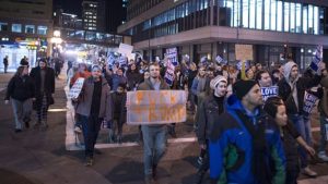 640px-Resist-FckTrumpYellowSignCrowd-Srce-FibonacciBlue