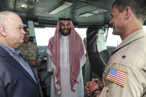150707-N-GR120-015 ARABIAN GULF (July 07, 2015) Prince Mohammed bin Salman bin Abdulaziz Al Saud, Second Deputy Premier, Deputy Crown Prince, Minister of Defense Kingdom of Saudi Arabia, speaks with Rear Adm. Andrew Lewis, commander of Carrier Strike Group (CSG) 12, aboard the aircraft carrier USS Theodore Roosevelt (CVN 71). Theodore Roosevelt is deployed in the U.S. 5th Fleet area of operations supporting Operation Inherent Resolve, strike operations in Iraq and Syria as directed, maritime security operations and theater security cooperation efforts in the region. (U.S. Navy photo by Mass Communication Specialist 3rd Class Anna Van Nuys/Released)