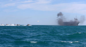 IRGC assault boats doing fire training on dummy US carrier. Source: FARS News, Hamed Jafarnejad, 2015.