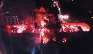 The roof of Notre Dame as perhaps its namesake Nostradamus foresaw it 463 years ago in a vision of the Dame in the glowing hot coals and wood embers by night that followed the late afternoon fire that had initially erupted in great columns of fire and smoke to at times completely obscure “Our Lady of Paris” so that she will no longer be in sight.