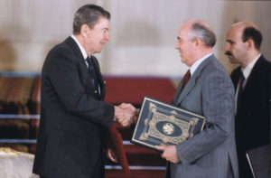 President Reagan and Soviet General Secretary Gorbachev shake hands after signing INF Treaty ratification in the Grand Kremlin Palace during the Moscow Summit. 1 June 1988.