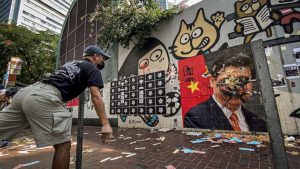 Hong Kong protest on 70th anniversary of People’s Republic of China, attacking poster of Chinese President Xi Jingping. Source: Studio Incendo, ©Wikimedia Commons.