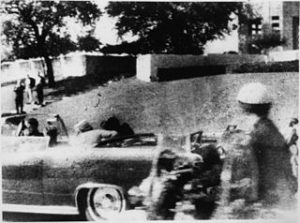 The moment Kennedy was killed by a sniper hiding this the wooded copse of the Grassy Knoll.