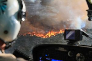 Helicopter Pilot flying over the Grizzly Creek Fire.