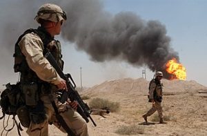 320px-US_Navy_U.S._Army_Sgt._guard_burning_oil_well_in_the_Rumaylah_IRAQ