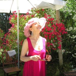 Madhuri-PinkHat-fushia dress-fushia-flowersIn-Background