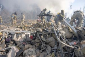 The aftermath of a Russian Kalibr hypersonic cruise missile attack on a Ukrainian barracks and staging ground outside of Mykolaiv (Nikolaev in Russian) at the start of Week Four of the Russo-Ukrainian War when large areas of the Azov and Black Sea provinces and cities of Ukraine fell to the methodical Russian advance. Hundreds of Ukrainian soldiers were killed and wounded. You can see the dead here tangled and mixed with twisted wreckage lying in heaps.