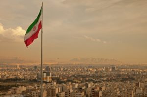 Iran-Skyline-afternoon-dusty-big-Iranian-flag